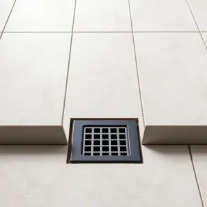 Jak układać płytki ze spadkiem do kratki