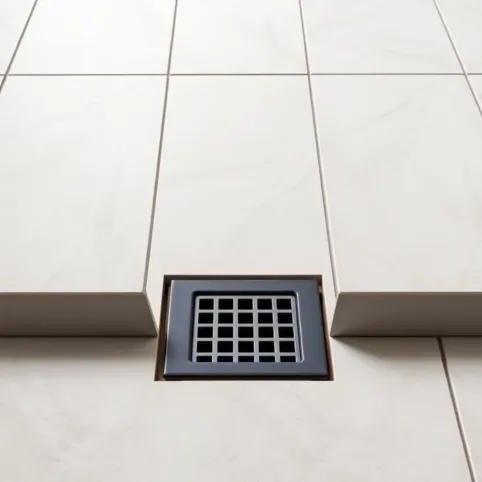 Jak układać płytki ze spadkiem do kratki